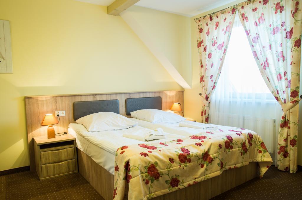 Sloneczny Port Bed and Breakfast Mikołajki Værelse billede