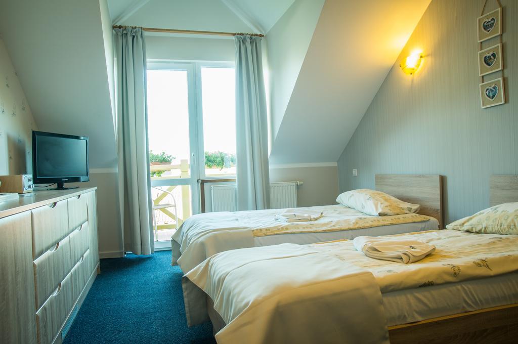 Sloneczny Port Bed and Breakfast Mikołajki Værelse billede